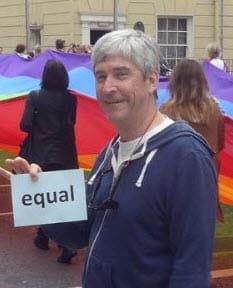 attorney Burris holding a sign that says "equal" at Dublin gay pride Parade